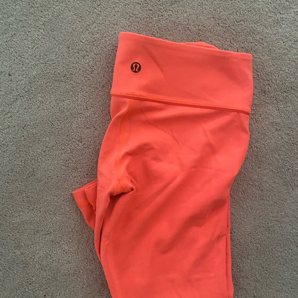 Excellent condition, only worn once. Lululemon Neon Wunder Under crop size 10.